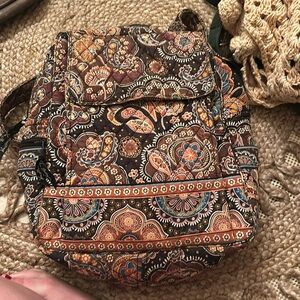Brown Vera Bradley backpack with multiple pockets inside& out. WB holder.